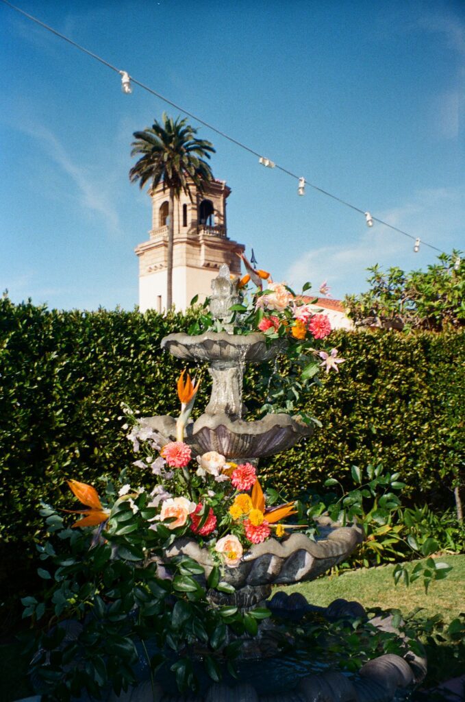 Floral-decorated Spanish fountain at San Diego garden wedding venue